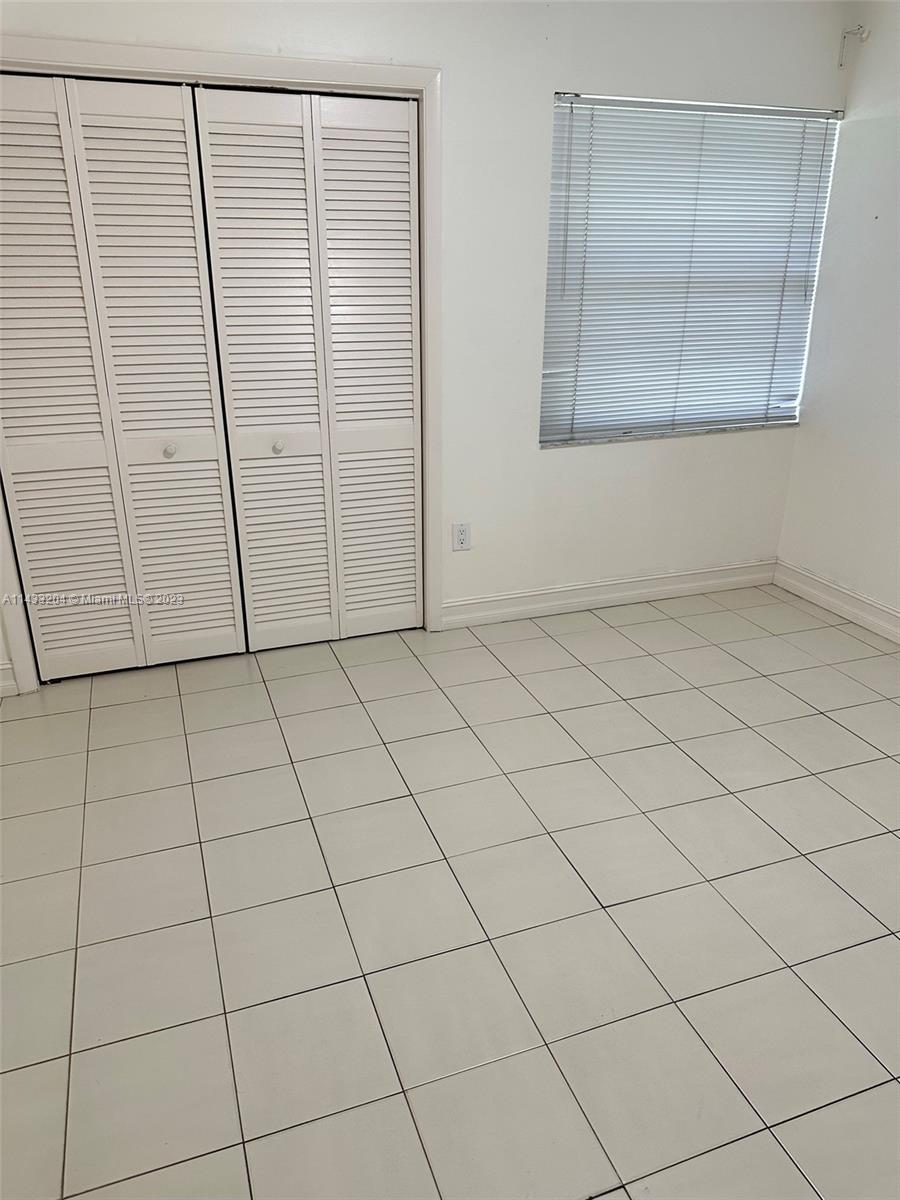 9110 Southwest 9th Terrace, Unit 9110 Miami, FL 33174 - Photo 10 of 17 an empty room with windows