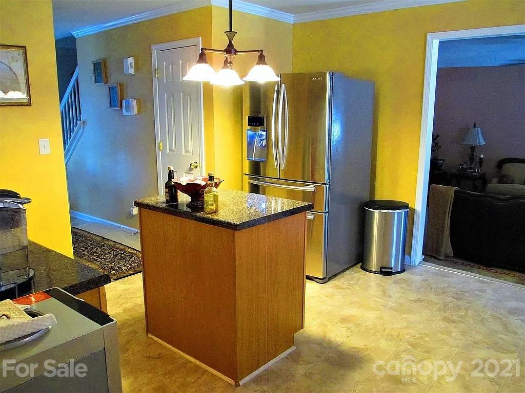 135 Scanlon Road Mooresville, NC 28115 - Photo 11 of 23 a kitchen with stainless steel appliances granite countertop a sink a refrigerator and a stove