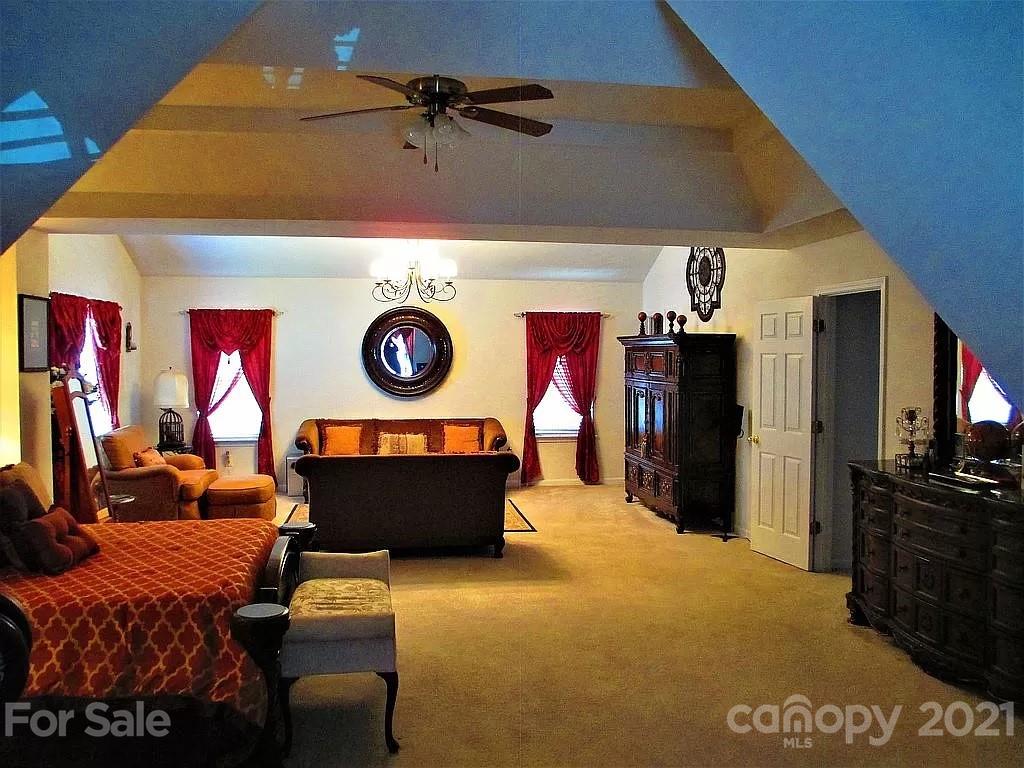 135 Scanlon Road Mooresville, NC 28115 - Photo 15 of 23 a view of a room with furniture and a flat screen tv