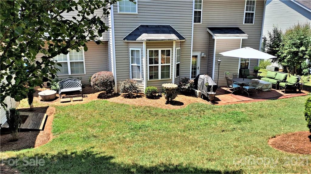 135 Scanlon Road Mooresville, NC 28115 - Photo 3 of 23 a view of a house with a backyard and sitting area