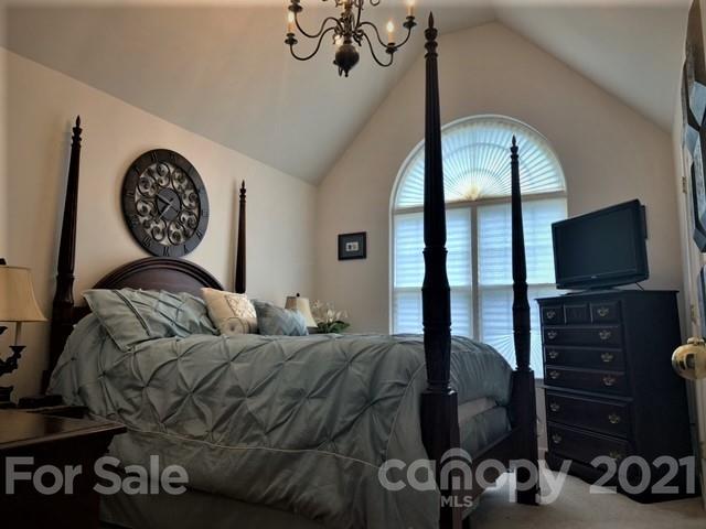 135 Scanlon Road Mooresville, NC 28115 - Photo 21 of 23 a bedroom with a bed window and a flat screen tv