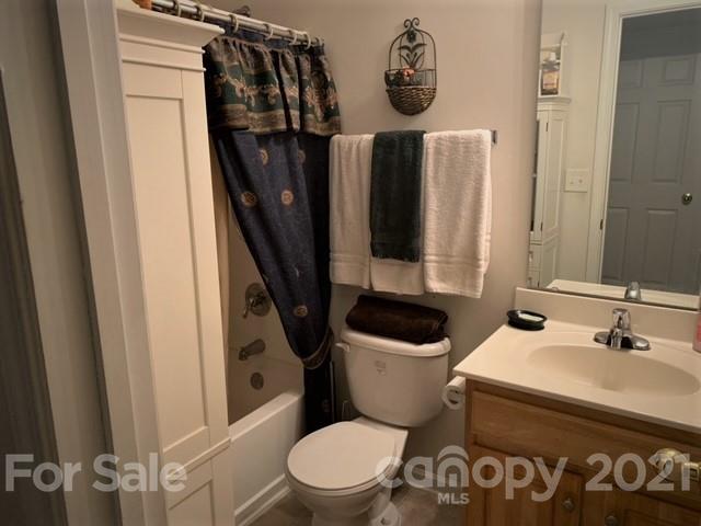 135 Scanlon Road Mooresville, NC 28115 - Photo 22 of 23 a bathroom with a toilet a sink and a mirror