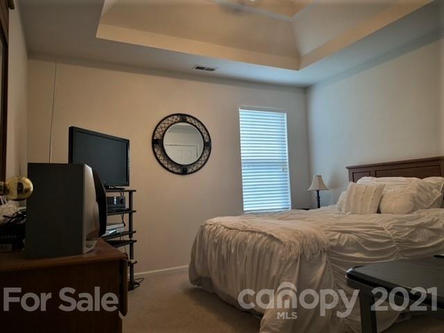 135 Scanlon Road Mooresville, NC 28115 - Photo 23 of 23 a bedroom with a bed and cabinets