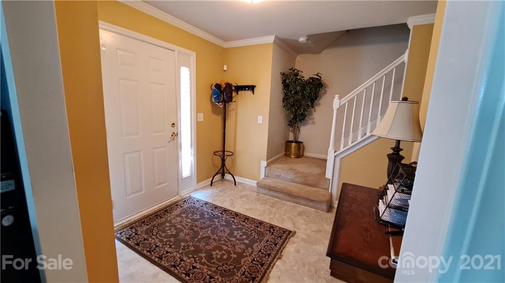 135 Scanlon Road Mooresville, NC 28115 - Photo 7 of 23 a view of entryway and hall with wooden floor