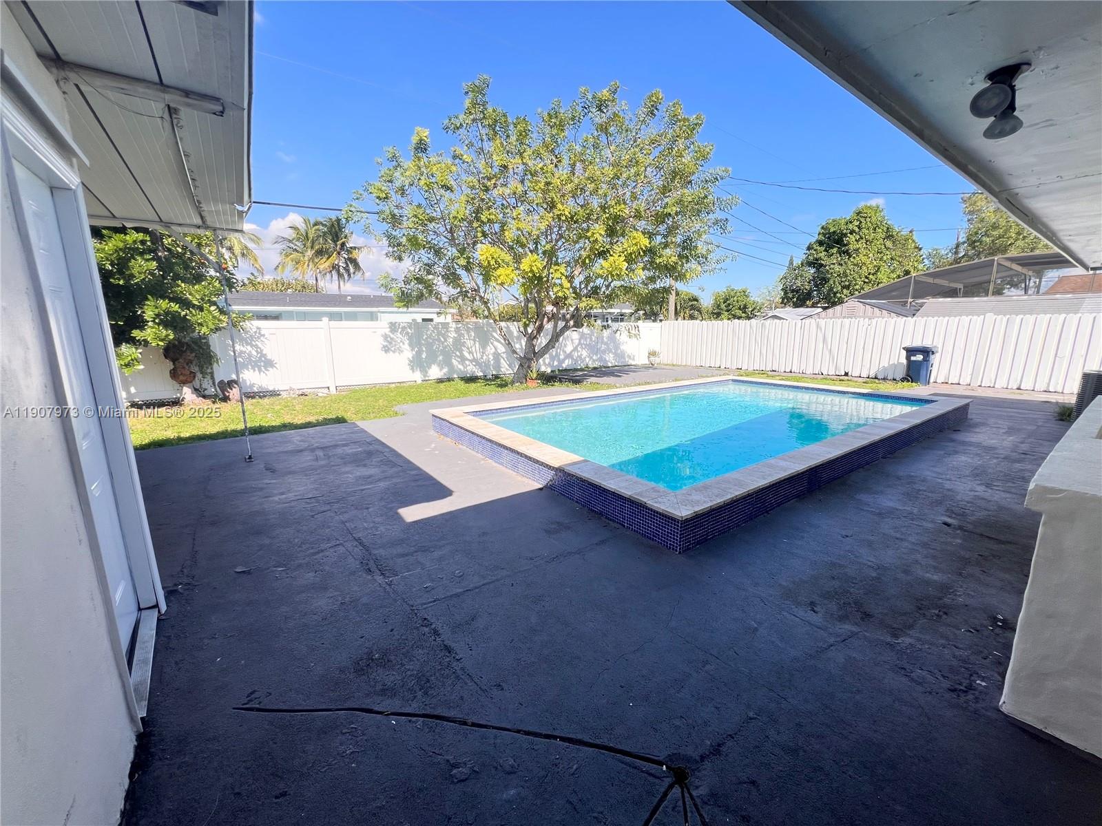 10005 Southwest 214th Street, Unit 10005 Cutler Bay, FL 33189 - Photo 17 of 22 a view of an outdoor space
