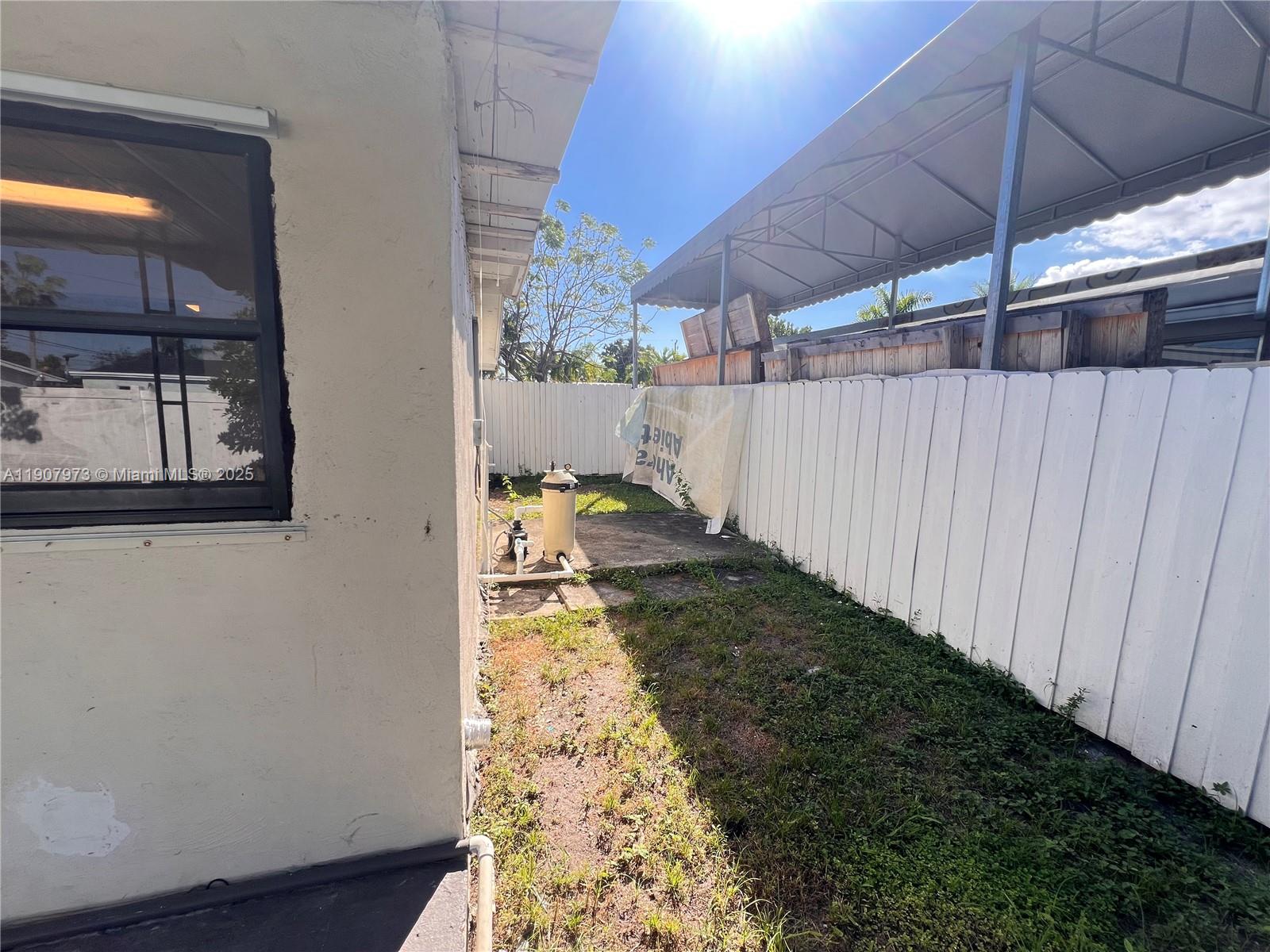 10005 Southwest 214th Street, Unit 10005 Cutler Bay, FL 33189 - Photo 20 of 22 a view of a backyard