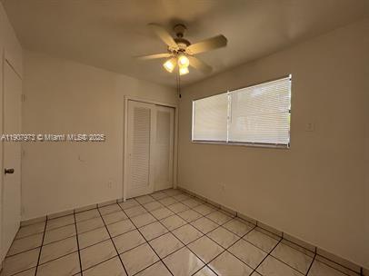10005 Southwest 214th Street, Unit 10005 Cutler Bay, FL 33189 - Photo 6 of 22 a view of an empty room