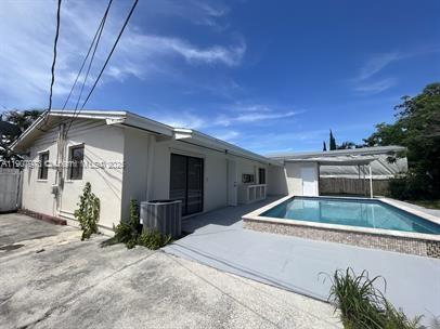 10005 Southwest 214th Street, Unit 10005 Cutler Bay, FL 33189 - Photo 8 of 22 a house view with a backyard space