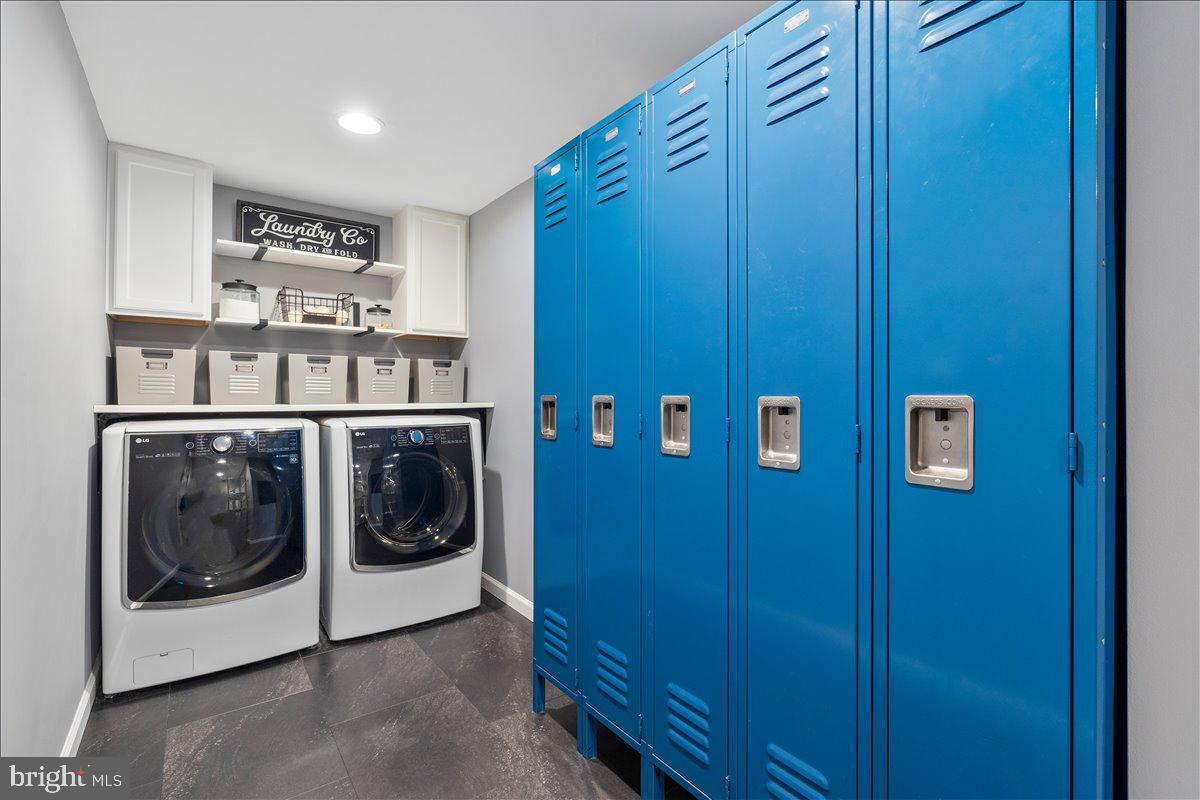 6117 Long Branch Road Frederick, MD 21701 - Photo 18 of 75 a utility room with wooden floor and washing machine