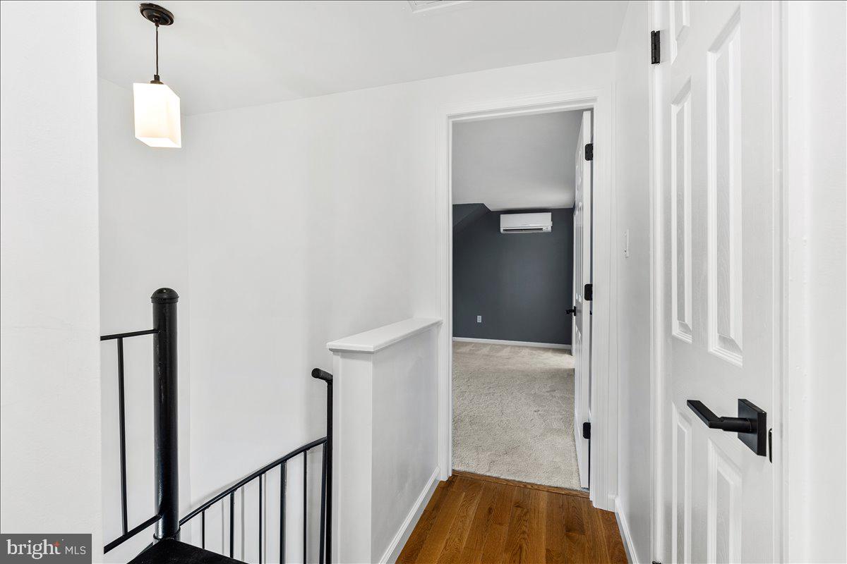 6117 Long Branch Road Frederick, MD 21701 - Photo 27 of 75 a view of a hallway with wooden floor and staircase
