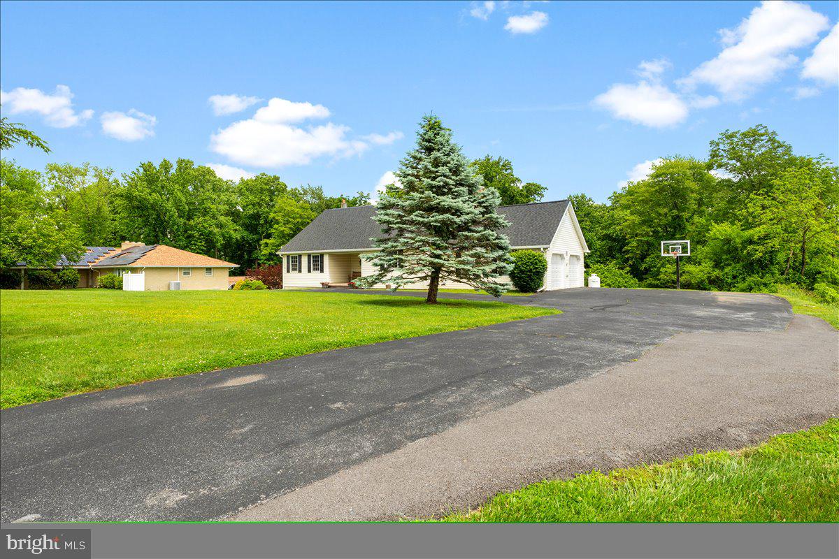 6117 Long Branch Road Frederick, MD 21701 - Photo 3 of 75 a view of a house with a big yard and large trees
