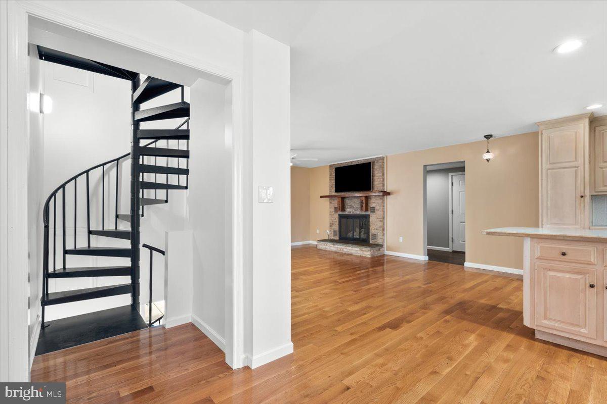 6117 Long Branch Road Frederick, MD 21701 - Photo 7 of 75 a view of a kitchen with wooden floor and electronic appliances
