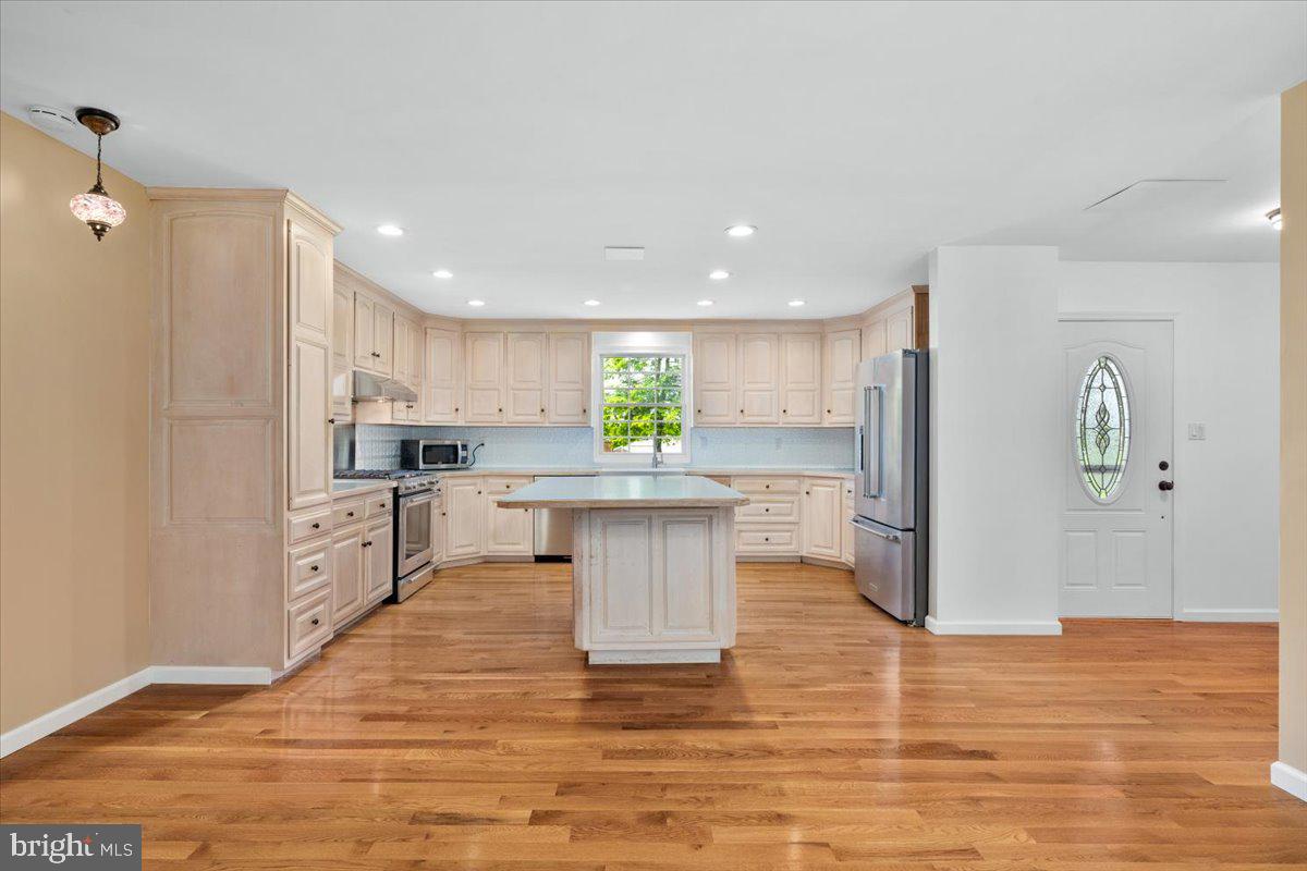 6117 Long Branch Road Frederick, MD 21701 - Photo 8 of 75 a kitchen with stainless steel appliances granite countertop a refrigerator a stove top oven and a sink
