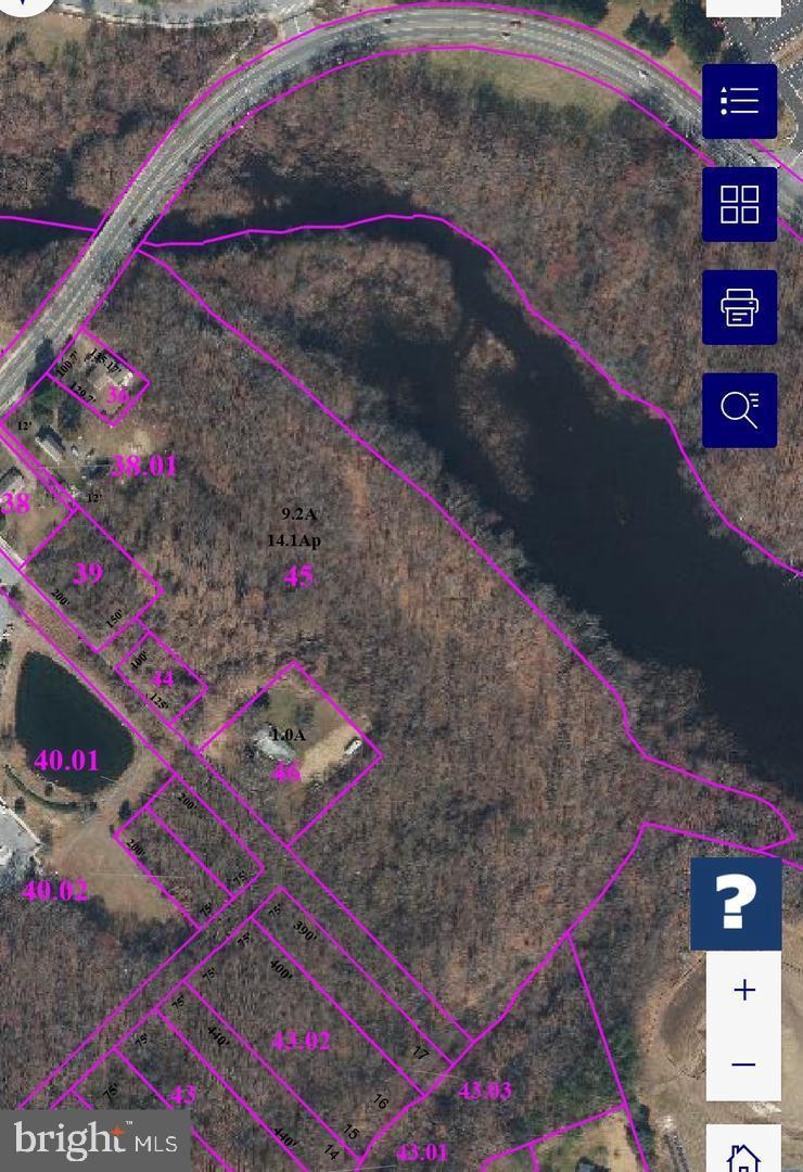 400 College Road Dover, DE 19904 - Photo 2 of 2 Aerial view of wooded land and waterway.