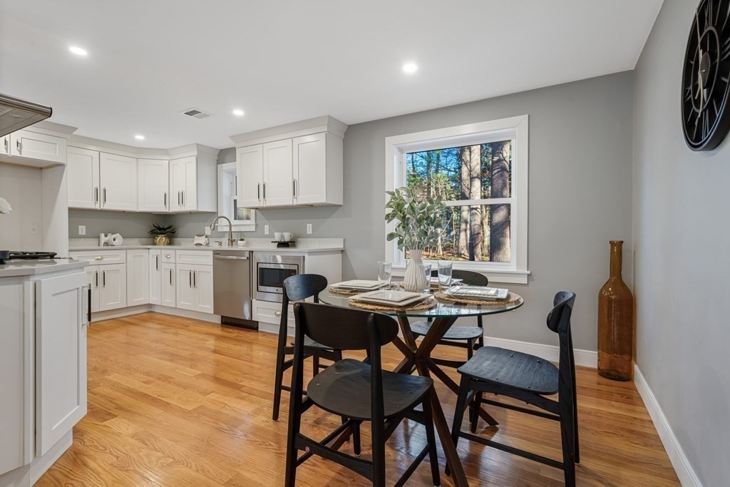 286 Hudson Road Sudbury, MA 01776 - Photo 11 of 34 a view of a dining room with furniture and a window