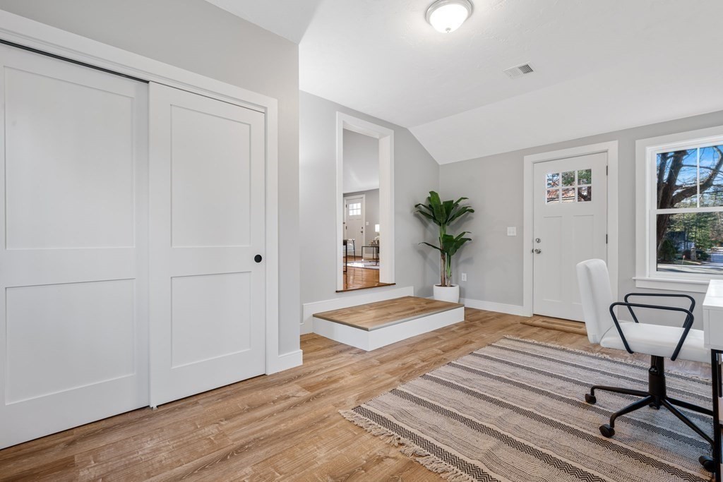 286 Hudson Road Sudbury, MA 01776 - Photo 15 of 34 a view of a livingroom with wooden floor and a potted plant