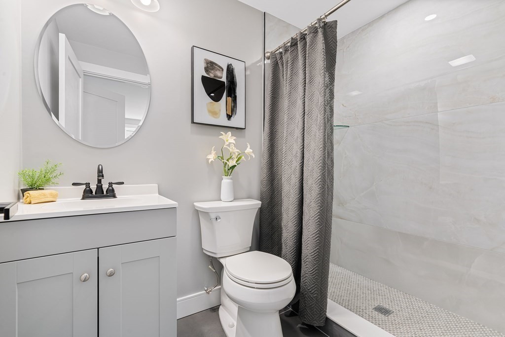 286 Hudson Road Sudbury, MA 01776 - Photo 23 of 34 a bathroom with a sink toilet and shower