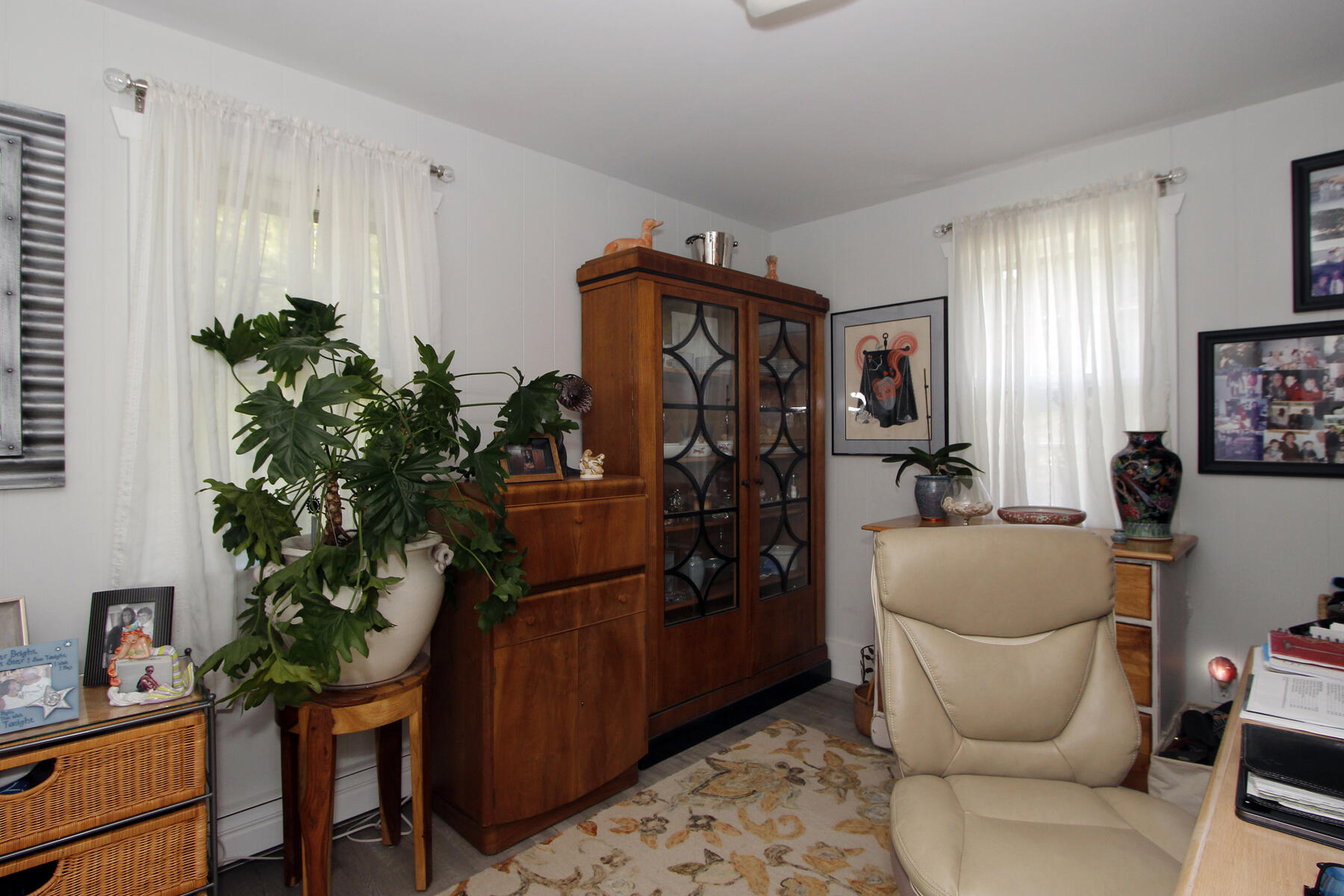 70 Deerfield Lane Eastham, MA 02642 - Photo 47 of 48 a living room with furniture and a potted plant