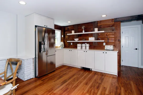 a view of front door with wooden floor