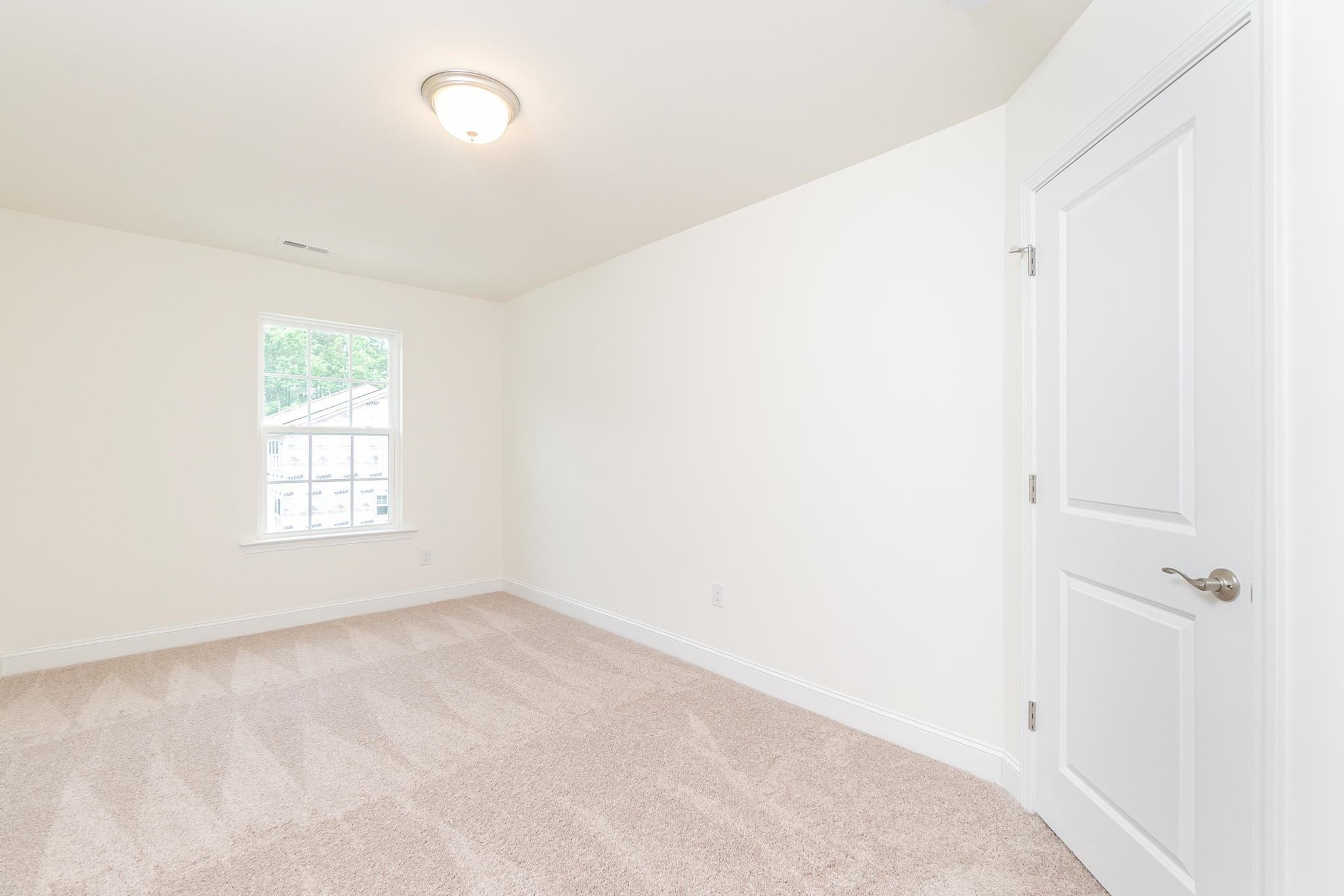 4743 Lord Fogelman Way Raleigh, NC 27610 - Photo 16 of 29 Secondary Bedroom Upstairs