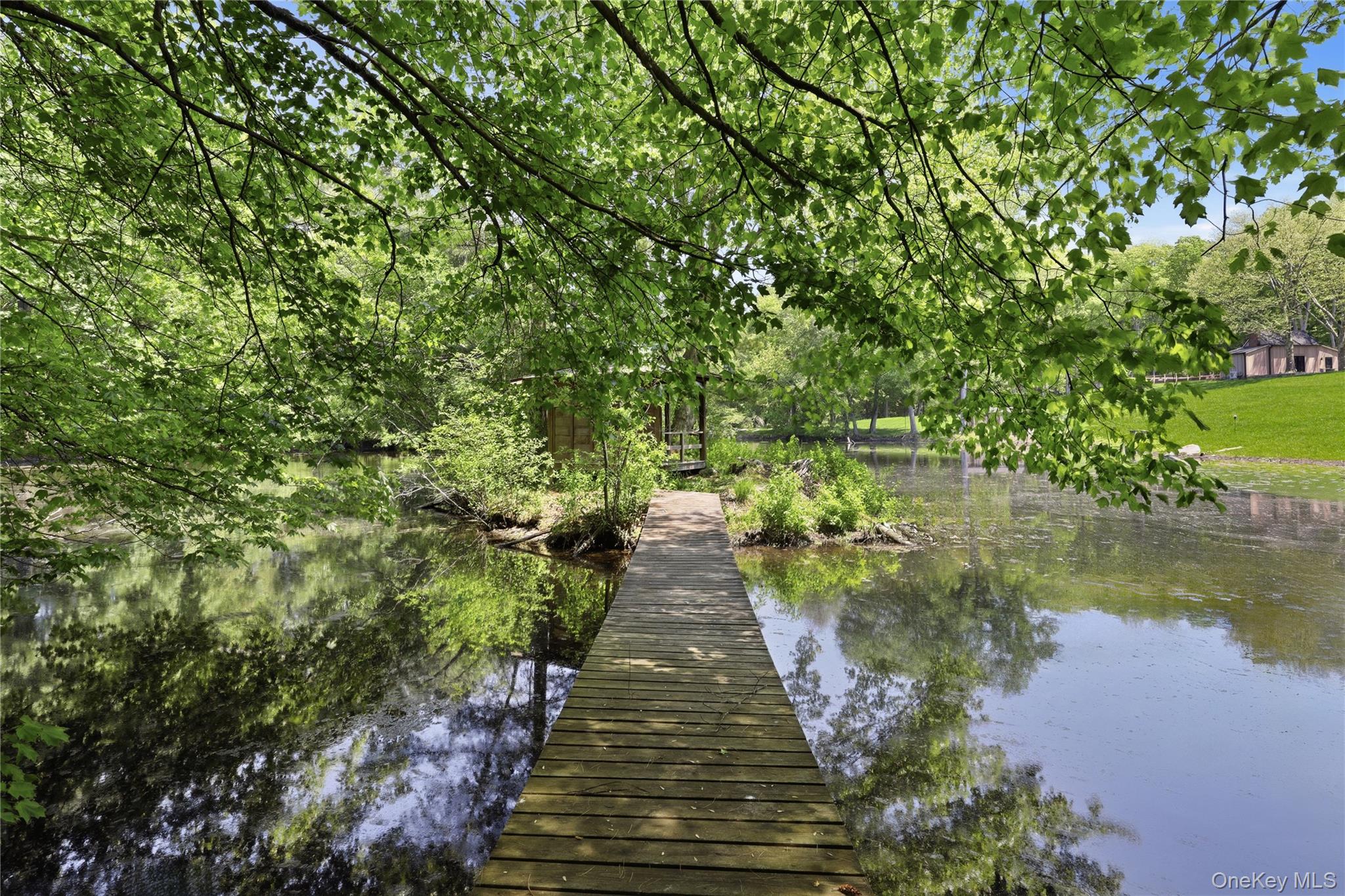 39 Old Snake Hill Road Pound Ridge, NY 10576 - Photo 35 of 37 a view of a pathway with a park