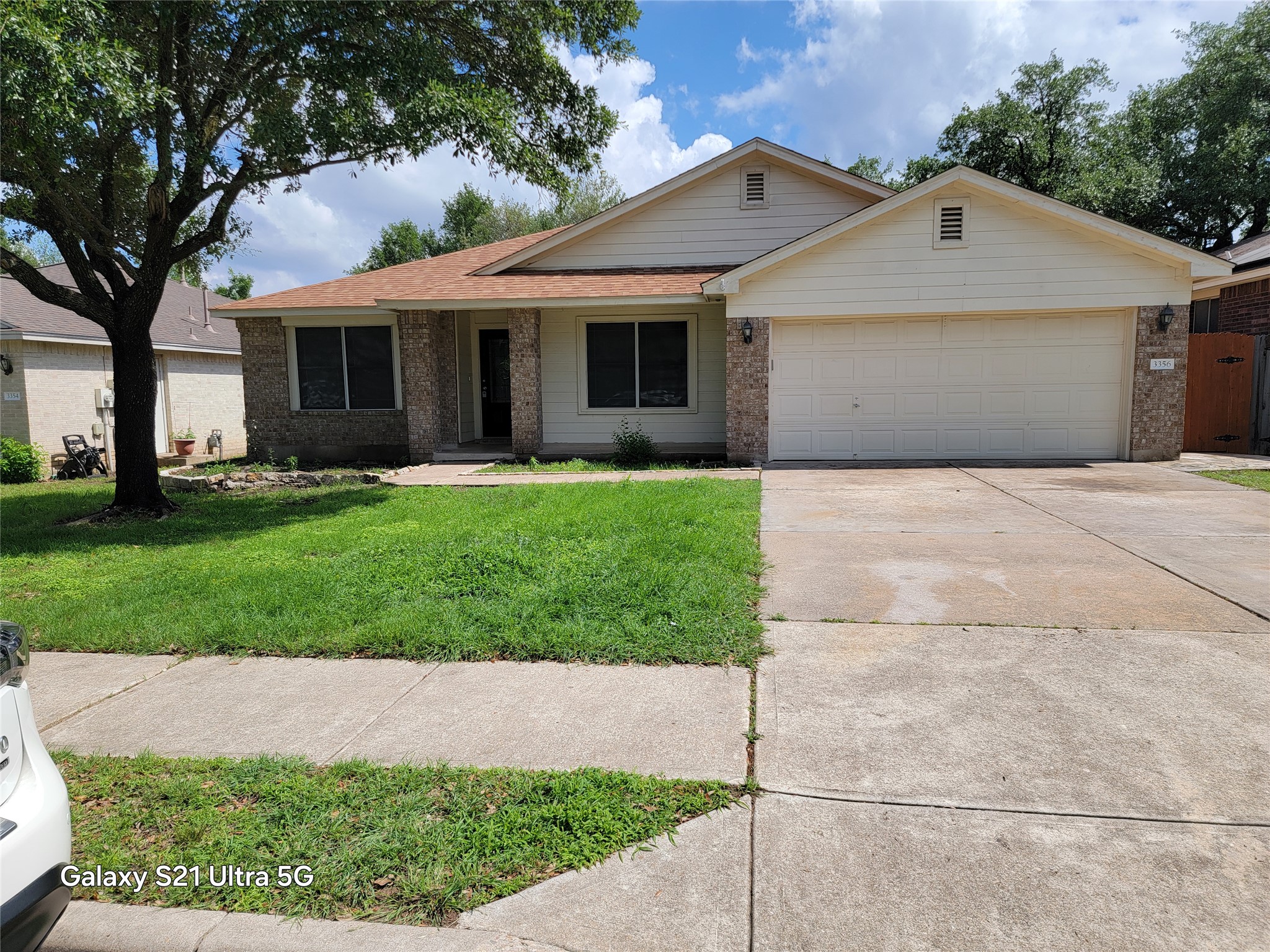 3356 Cantera Way Round Rock, TX 78681 - Photo 1 of 22 a front view of a house with a yard and garage