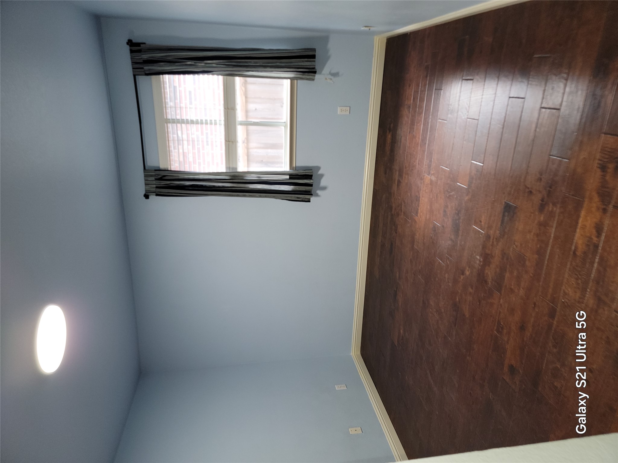 3356 Cantera Way Round Rock, TX 78681 - Photo 11 of 22 an empty room with wooden floor and windows