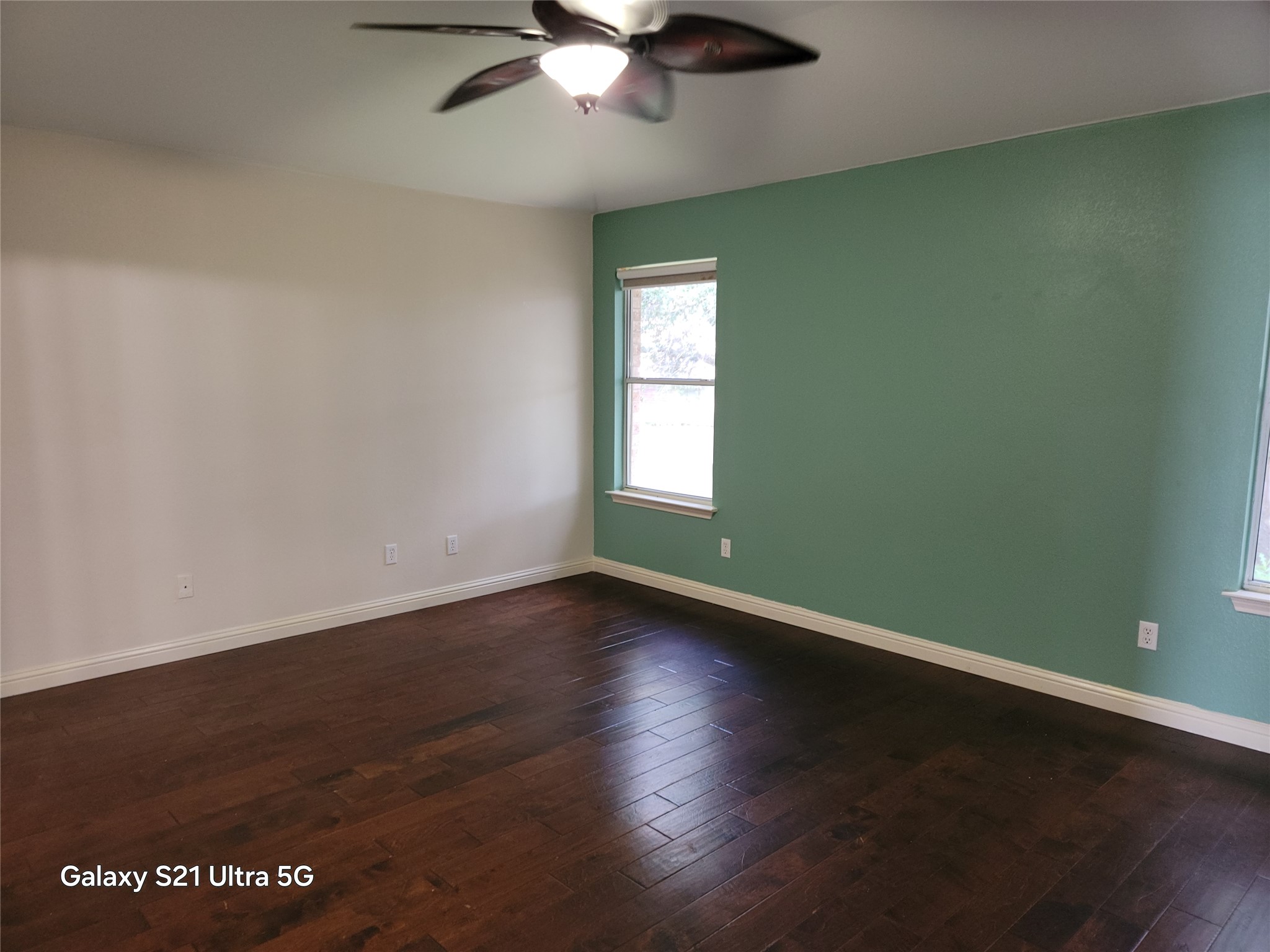 3356 Cantera Way Round Rock, TX 78681 - Photo 15 of 22 a view of an empty room with wooden floor and a window