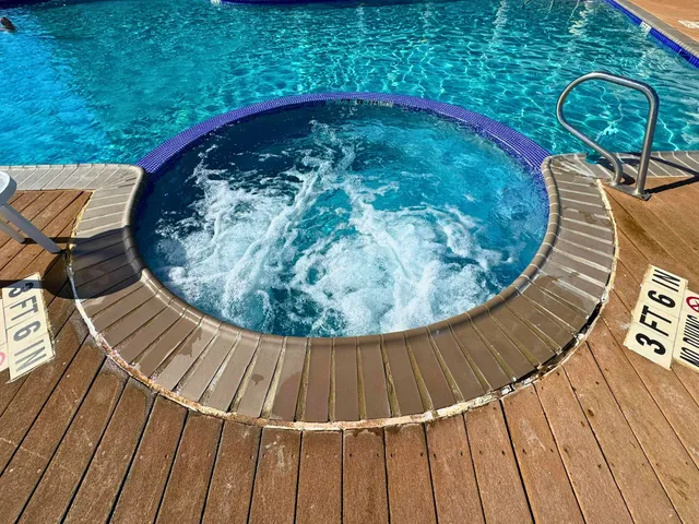a view of swimming pool from a balcony