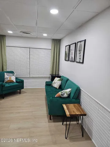 a living room with furniture and a rug