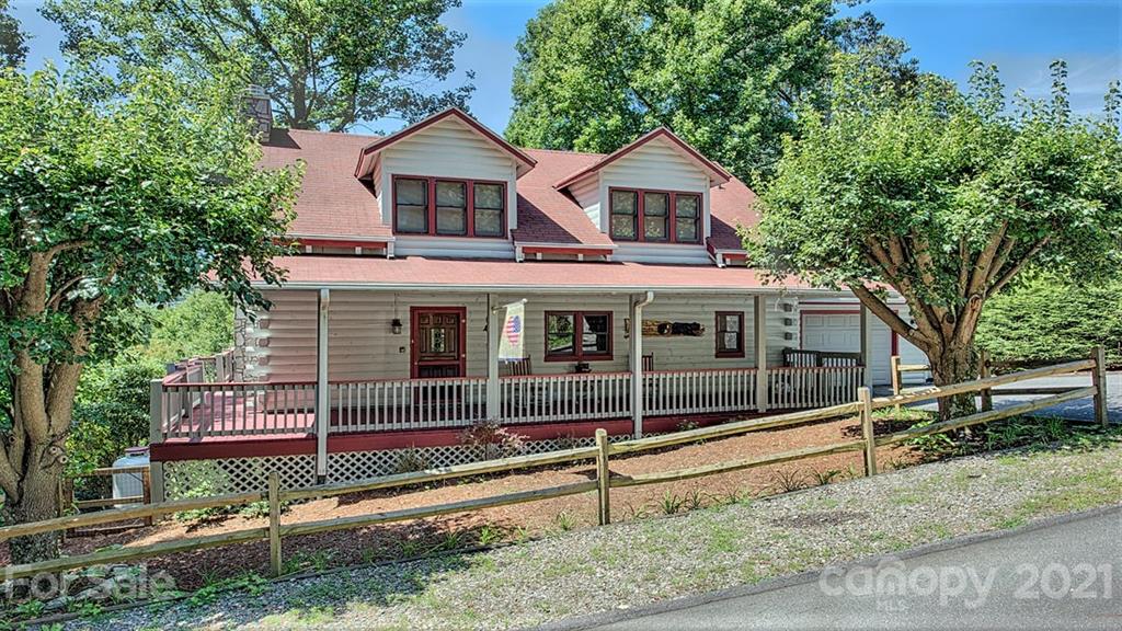 49 Sunrise Ridge Maggie Valley, NC 28751 - Photo 1 of 24 a front view of a house with a yard