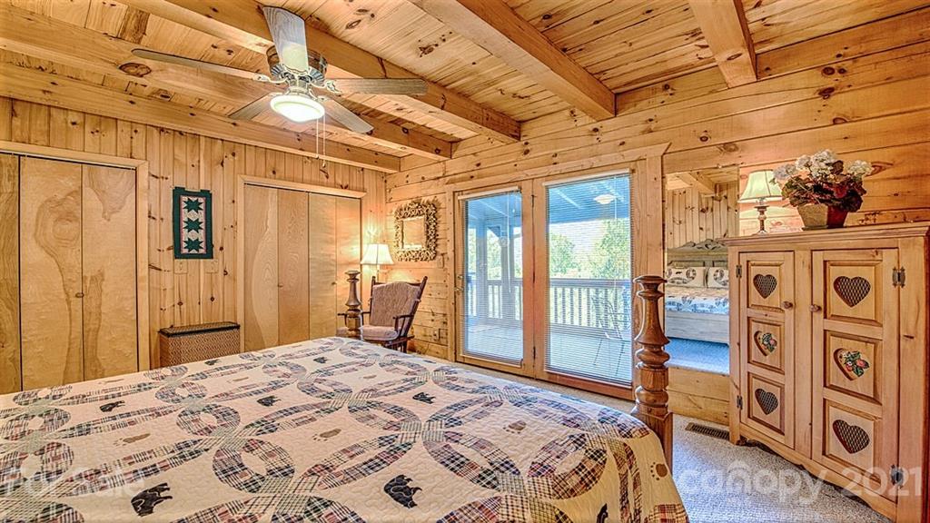 49 Sunrise Ridge Maggie Valley, NC 28751 - Photo 11 of 24 a bedroom with a bed next to a window