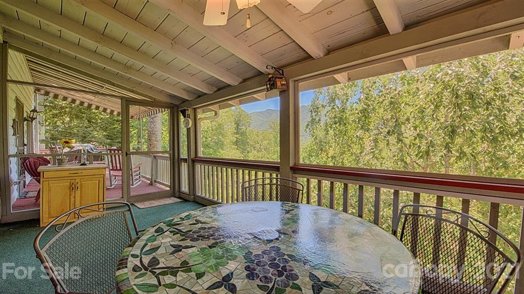 49 Sunrise Ridge Maggie Valley, NC 28751 - Photo 12 of 24 a view of a porch with furniture and wooden floor