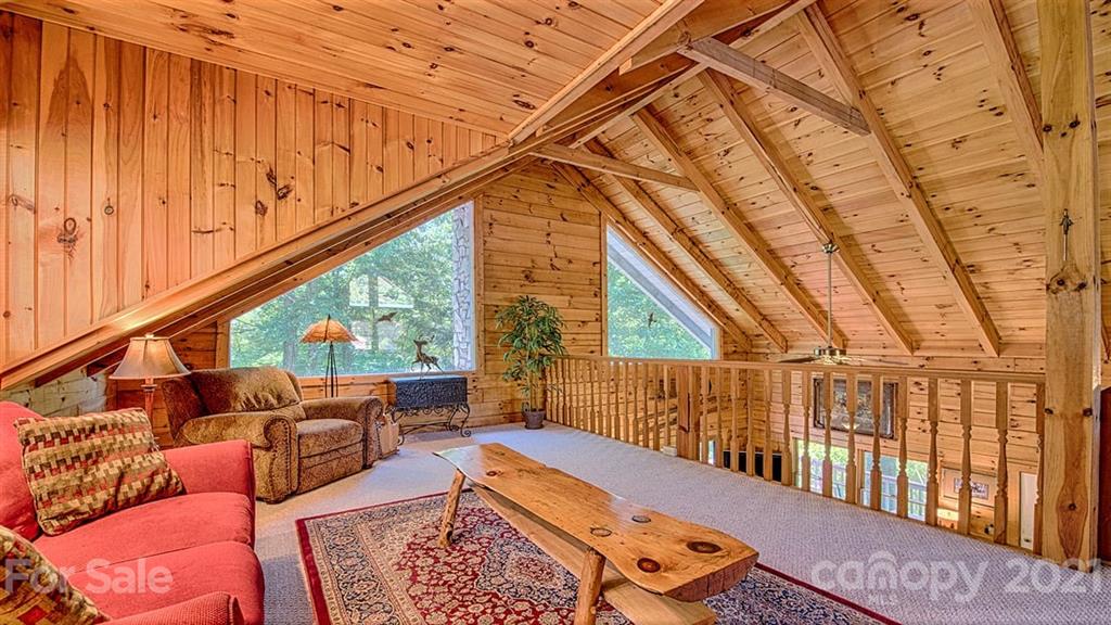 49 Sunrise Ridge Maggie Valley, NC 28751 - Photo 15 of 24 a balcony with furniture and wooden floor