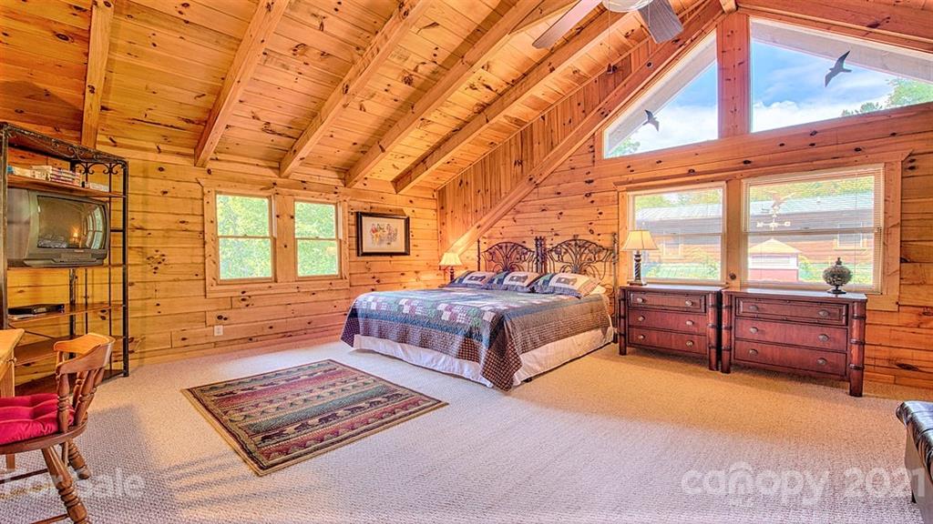 49 Sunrise Ridge Maggie Valley, NC 28751 - Photo 16 of 24 a bedroom with a bed and wooden floor