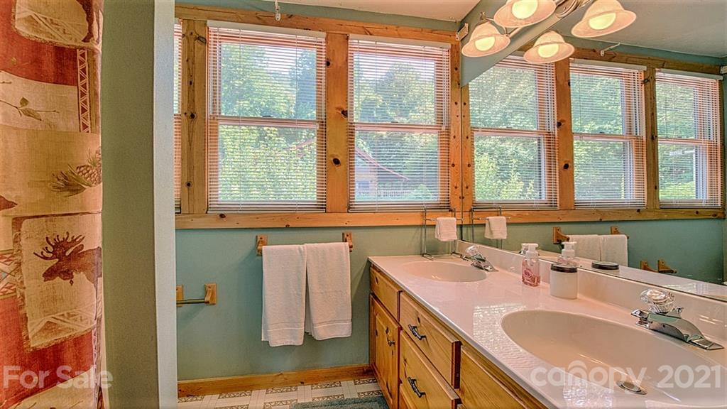 49 Sunrise Ridge Maggie Valley, NC 28751 - Photo 18 of 24 a bathroom with a sink and a window