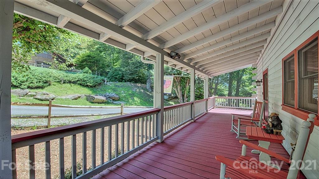 49 Sunrise Ridge Maggie Valley, NC 28751 - Photo 3 of 24 a view of a porch with wooden floor and outdoor space