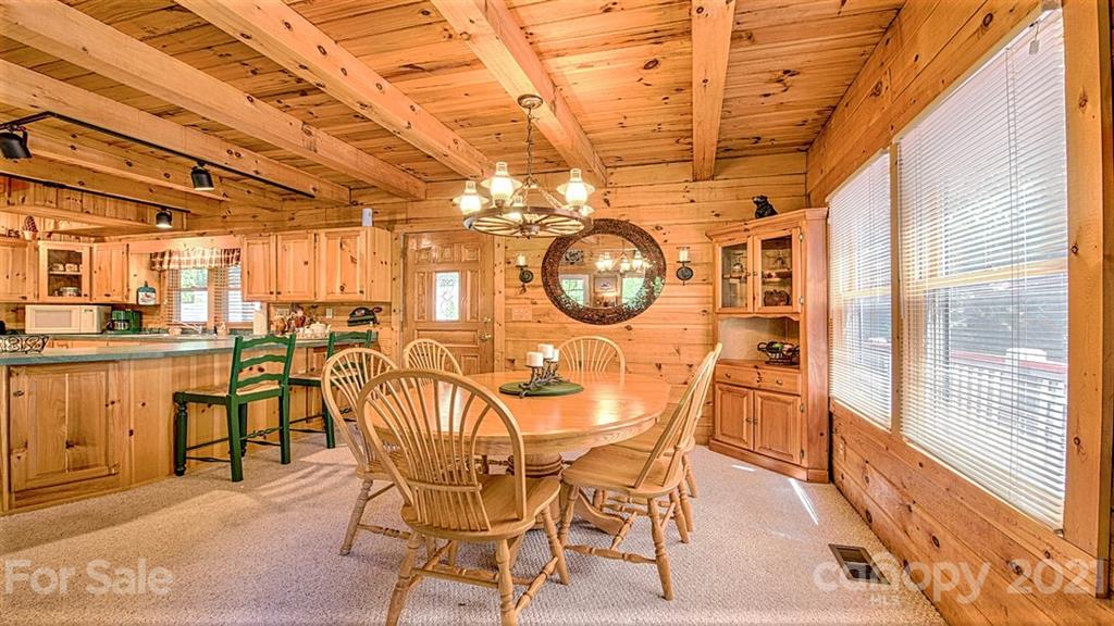 49 Sunrise Ridge Maggie Valley, NC 28751 - Photo 6 of 24 a dining room with furniture and a mirror