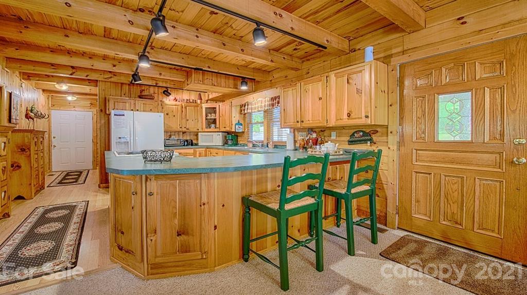49 Sunrise Ridge Maggie Valley, NC 28751 - Photo 7 of 24 a view of a kitchen with furniture and a window