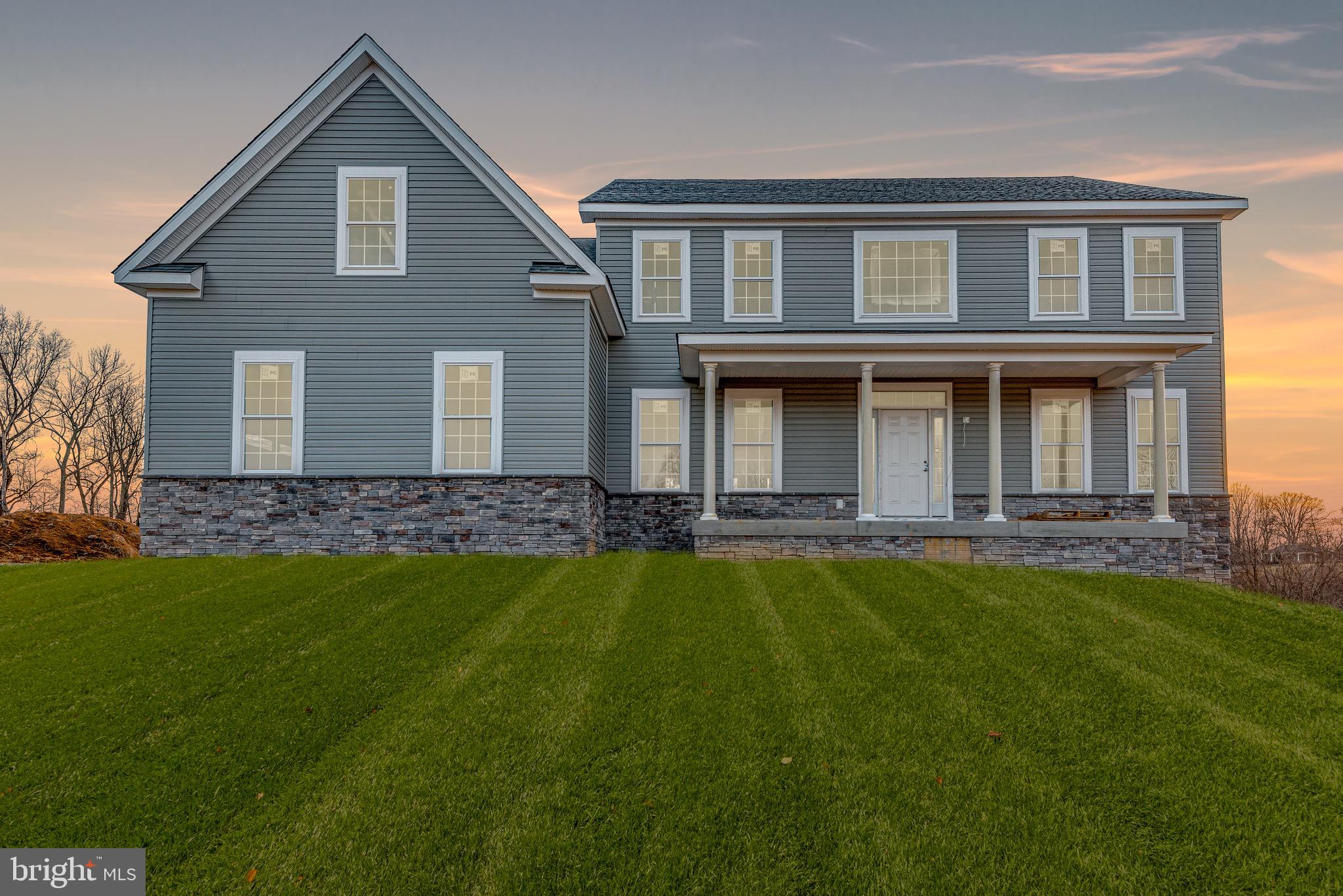 1319 German Driveway Hanover, MD 21076 - Photo 11 of 11 a front view of a house with a yard