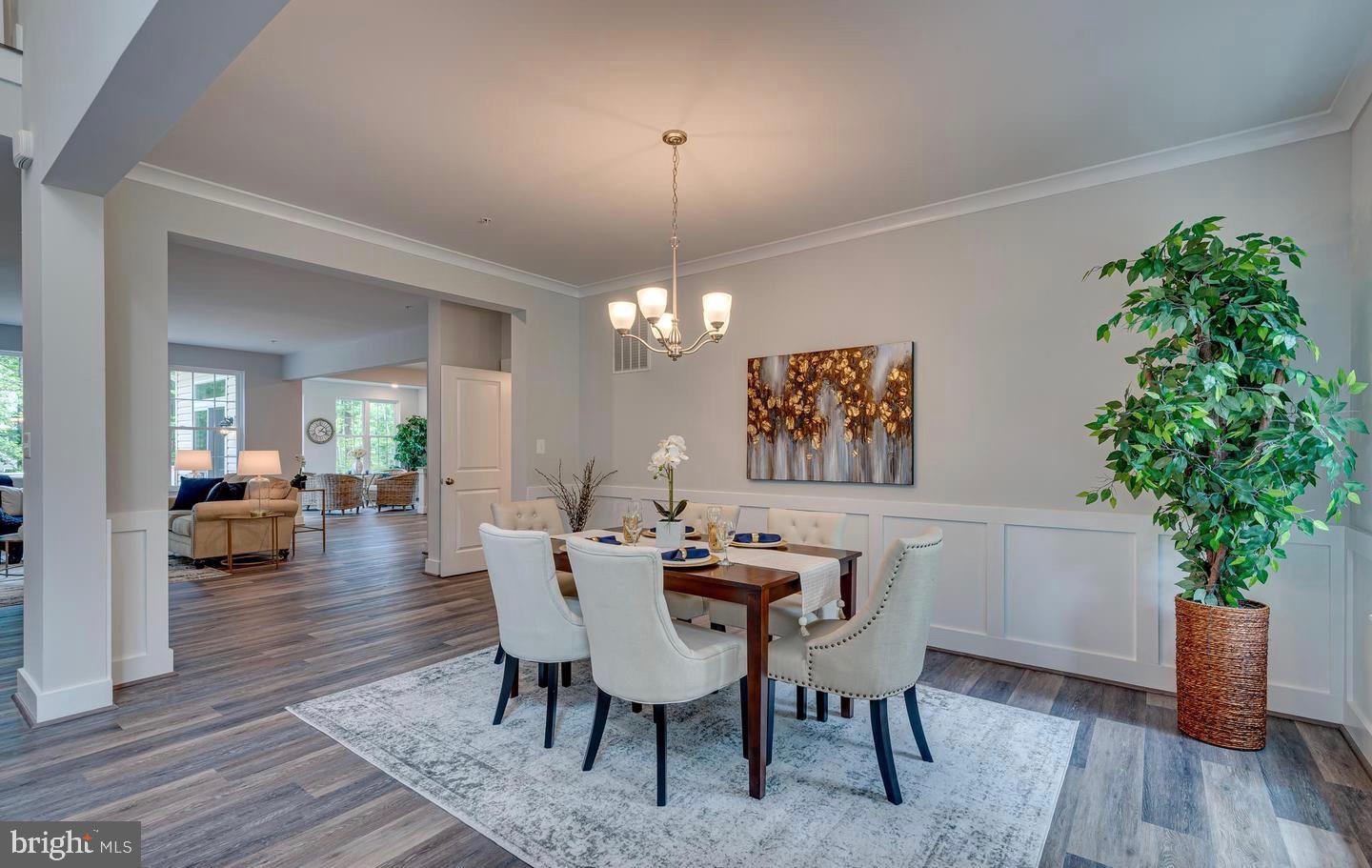 1319 German Driveway Hanover, MD 21076 - Photo 2 of 11 a view of a dining room with furniture window and wooden floor