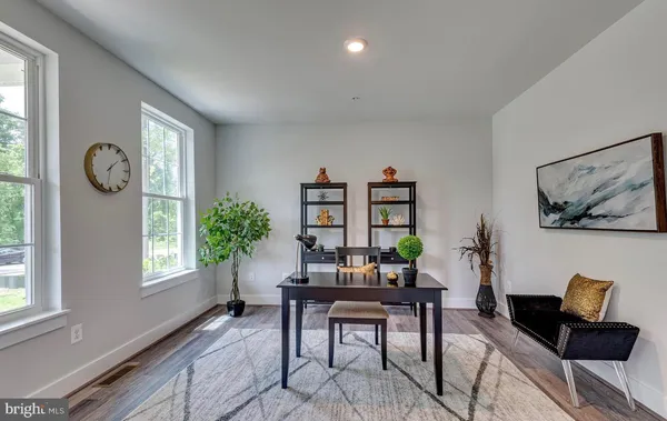 a workspace with furniture and a window