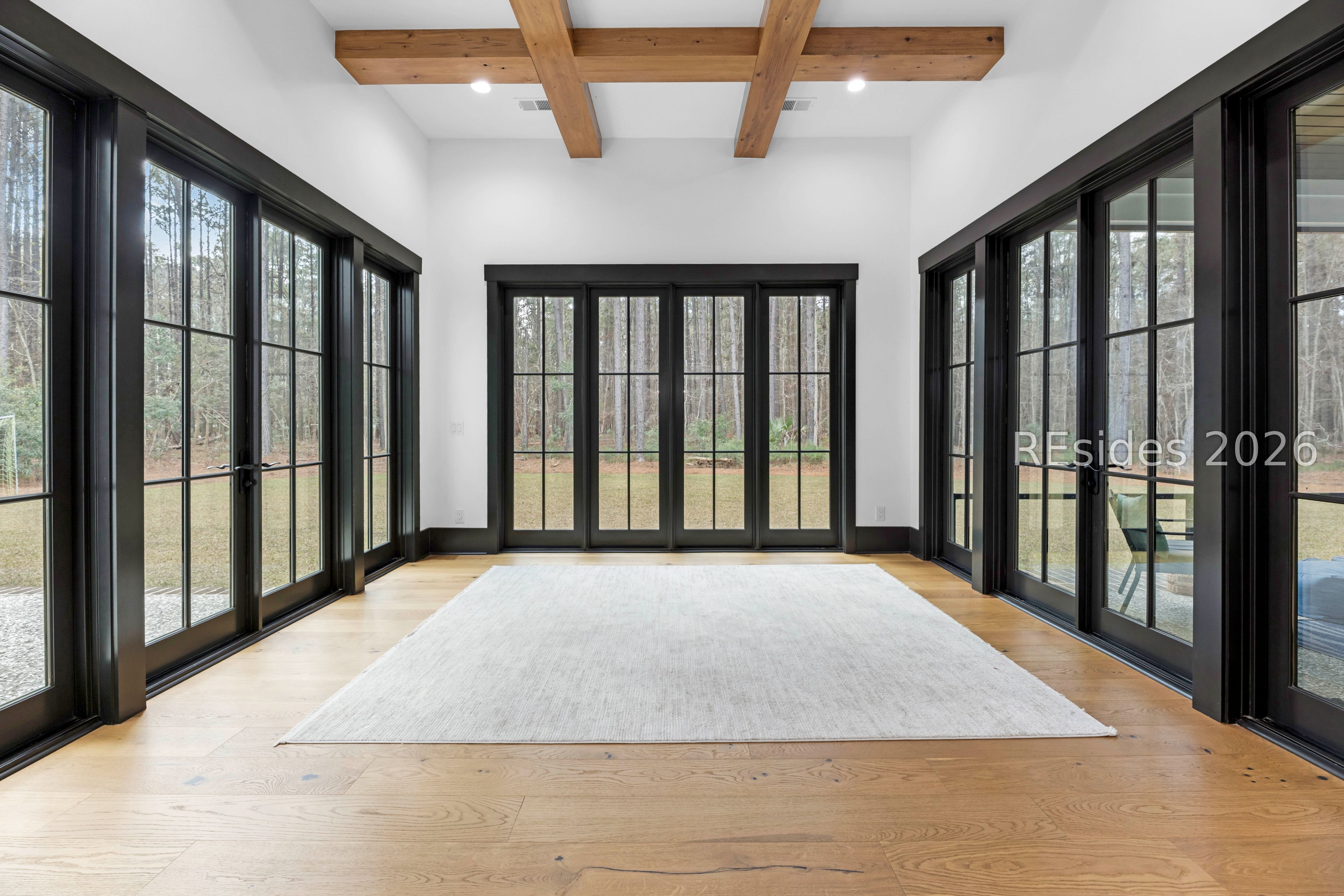31 Foxchase Lane Bluffton, SC 29910 - Photo 14 of 80 Formal dining exits to enclosed outdoor spaces