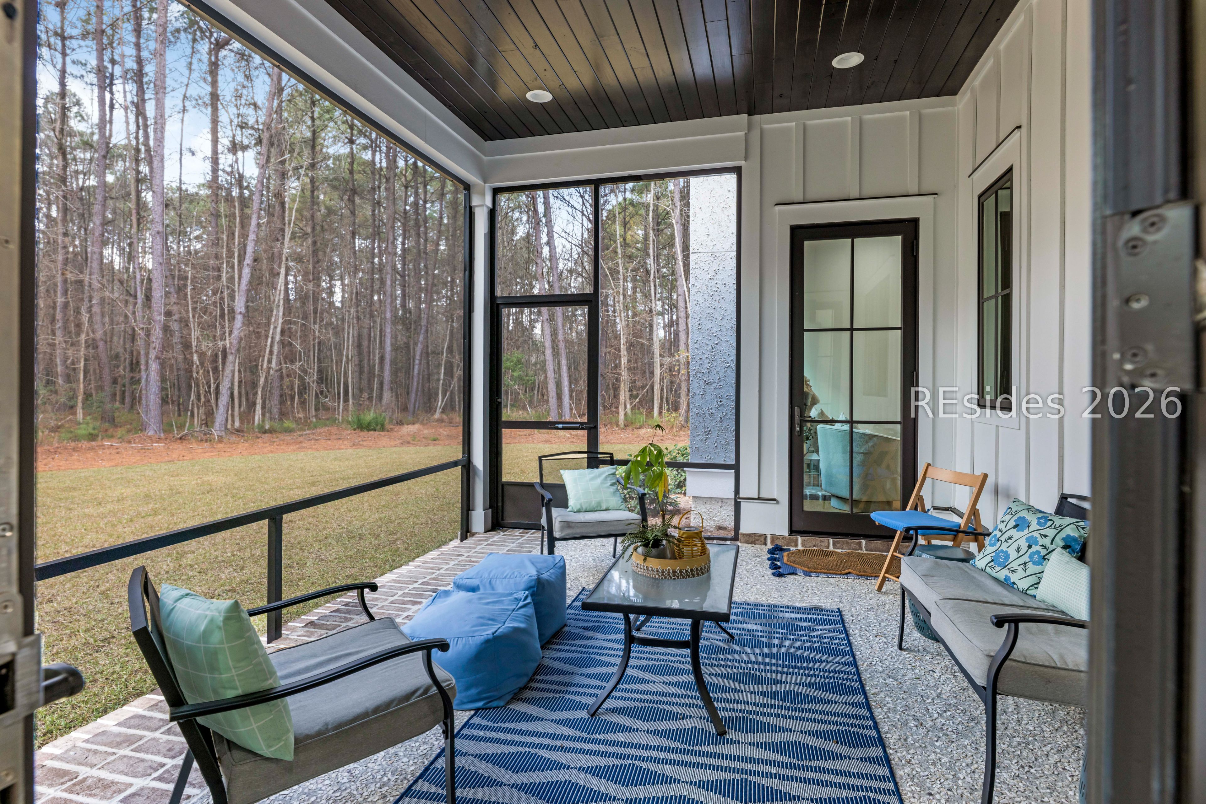 31 Foxchase Lane Bluffton, SC 29910 - Photo 16 of 80 Outdoor screened space from formal dining