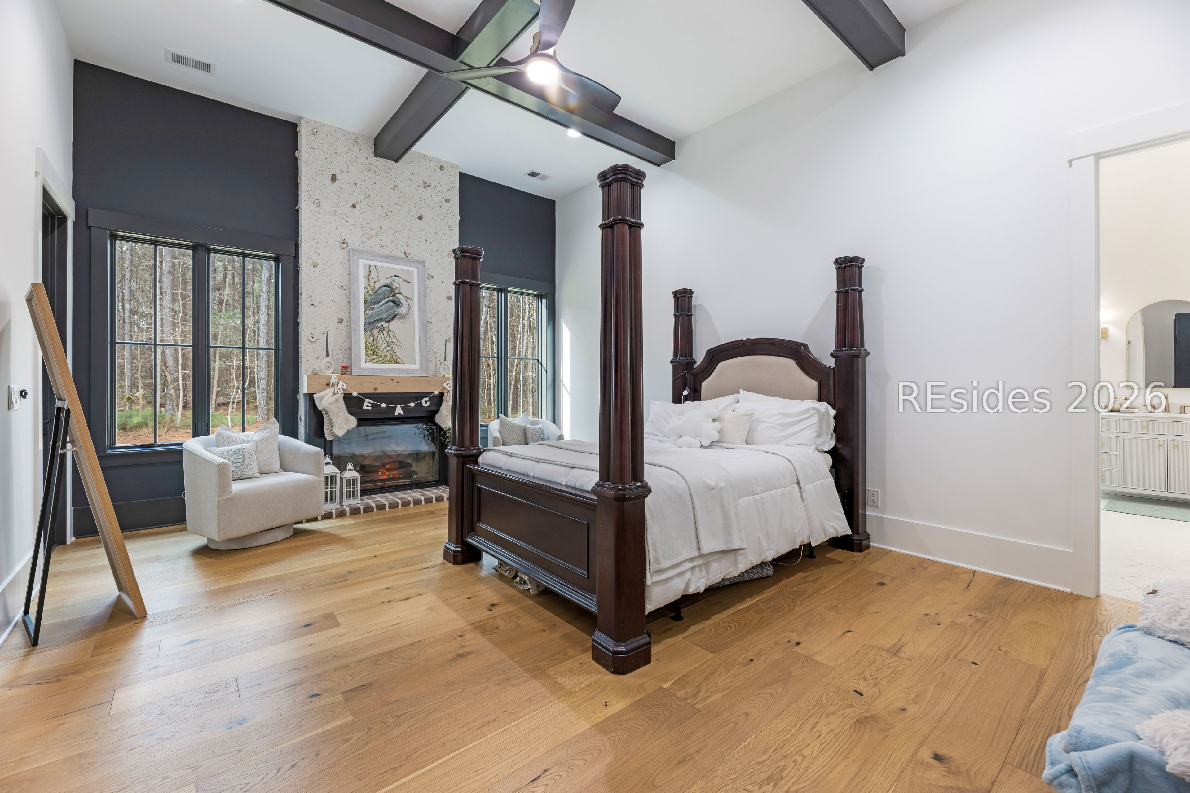 31 Foxchase Lane Bluffton, SC 29910 - Photo 38 of 80 Primary bedroom with gas fireplace