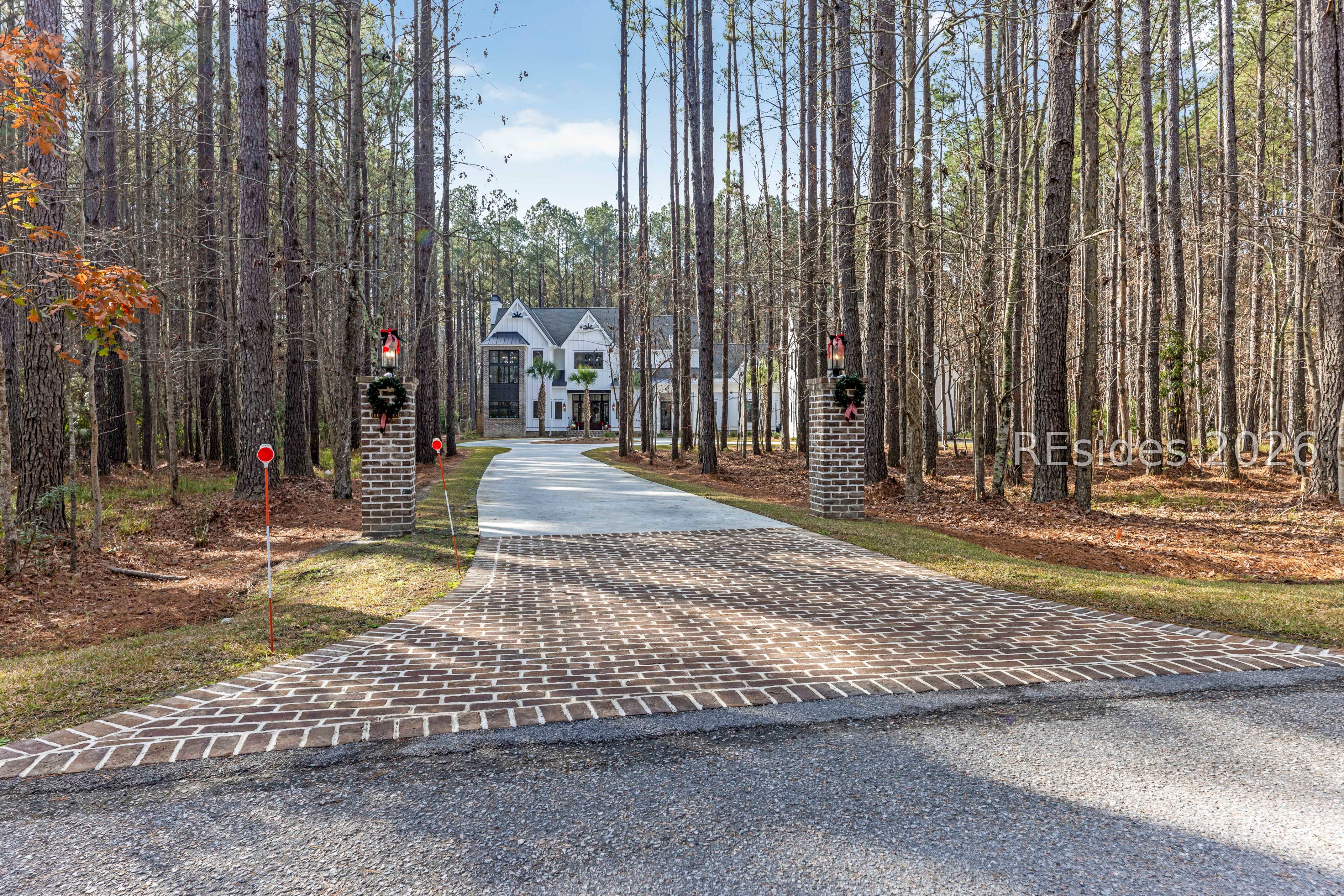 31 Foxchase Lane Bluffton, SC 29910 - Photo 77 of 80 Long driveway Hang layed brick entrance