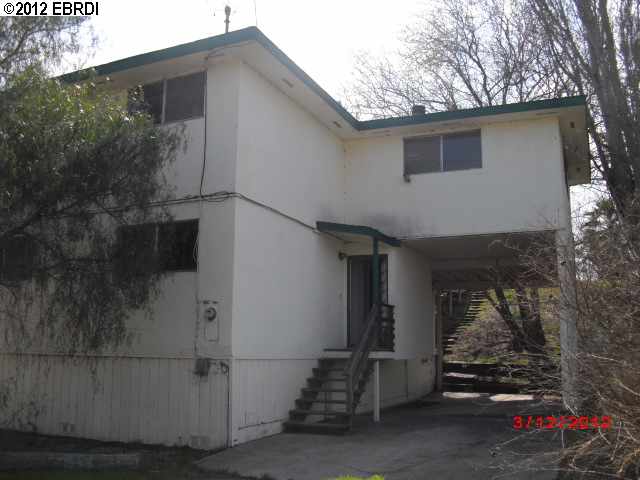 a house with trees in front of it