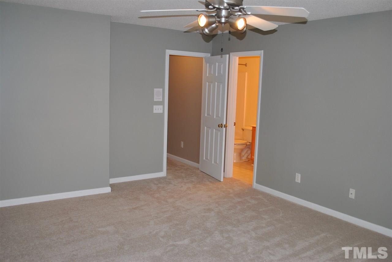 4709 Mocha Lane Raleigh, NC 27616 - Photo 14 of 25 a view of an empty room with a chandelier fan