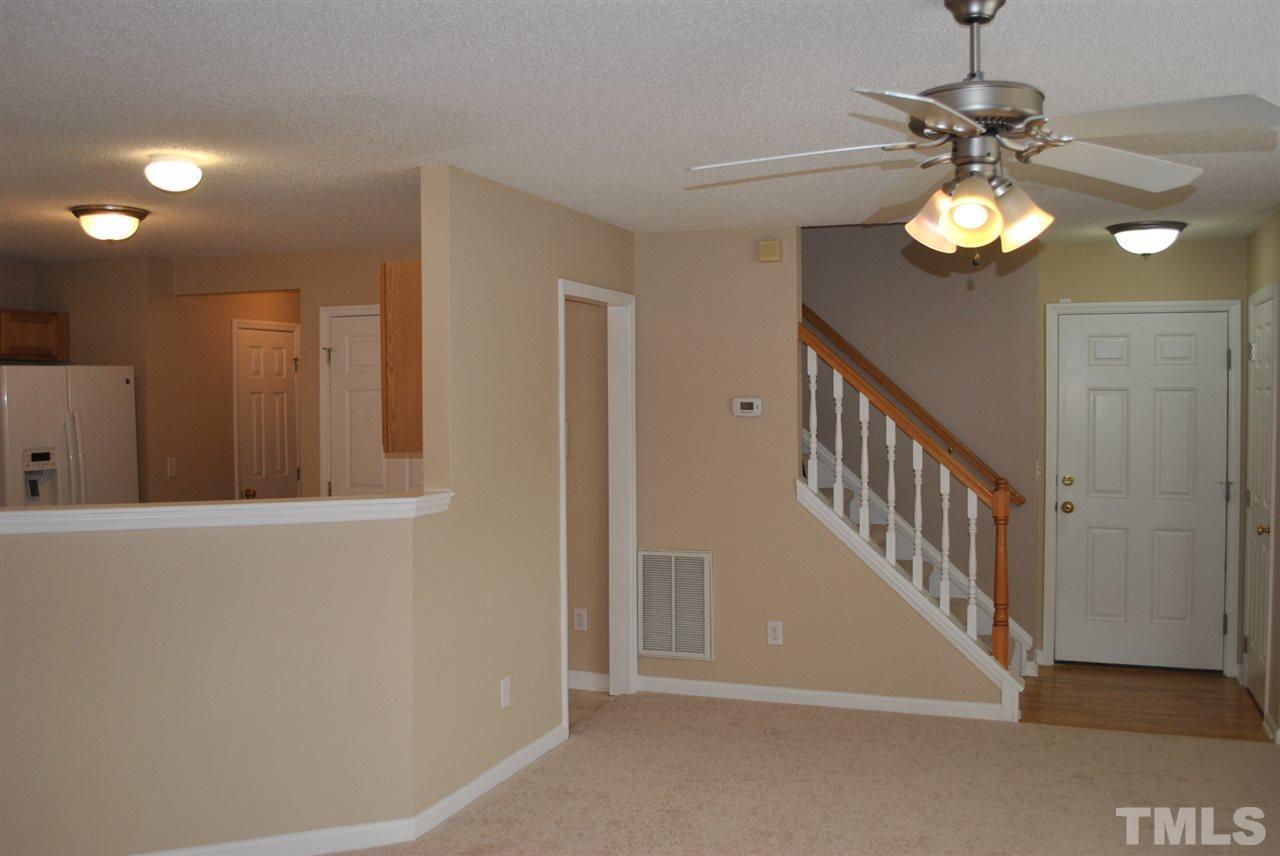 4709 Mocha Lane Raleigh, NC 27616 - Photo 8 of 25 a view of an entryway with a chandelier