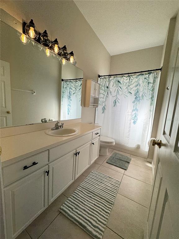 28724 Hanging Moss Loop Wesley Chapel, FL 33543 - Photo 20 of 30 a bathroom with a double vanity sink mirror and shower